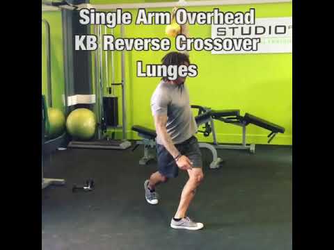 Single Arm Overhead KB Reverse Crossover Lunges